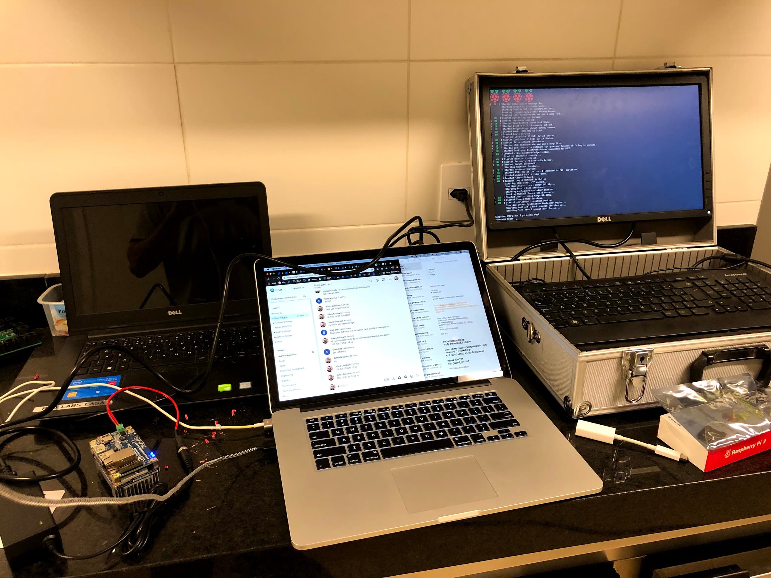 Raspberry Pis and a Jetson Nano being configured and boot-tested on a workbench